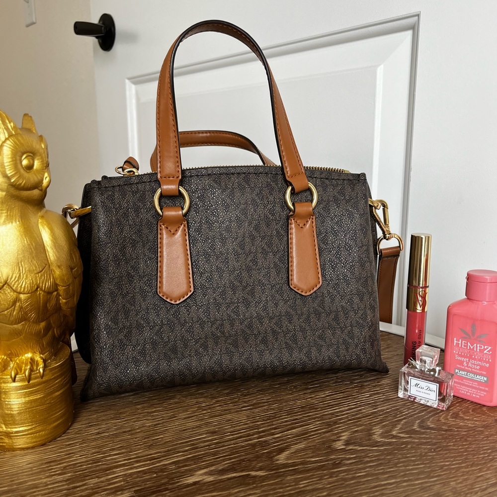 Michael Kors brown medium belted satchel. Gently used. Adjustable strap